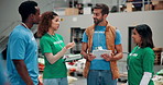 Volunteer, team and people in warehouse for charity, inventory discussion and food bank. Donation, help and community service at storehouse with manager planning or delegation for delivery on tablet