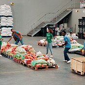Food drive, packing and passing with volunteer people in community ...