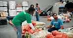 Food drive, packing and sorting with volunteer people in community center for activism. Charity. social responsibility and teamwork with humanitarian team organizing donations for outreach program