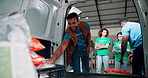 Charity, food drive and van with volunteer people unpacking donations for community outreach. Aid, NGO and timelapse with non profit team collecting groceries in vehicle for social responsibility