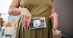 Hands, pregnant woman and stomach with ultrasound at house, baby scan and maternity wellness. Expecting mother, xray picture and pregnancy results for growth development, family planning and prenatal