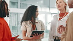 Group, discussion and women with tablet, business and collaboration for ad campaign and colleagues. Meeting, media strategist and people with tech in office, talking and communication for project
