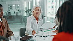 Business, women or manager with documents for planning, meeting or financial report in accounting firm. People, company budget or mature CEO giving paperwork in discussion for update and teamwork