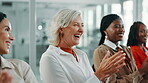 Laughing, applause and women in conference, success and celebration for accomplishment, audience and meeting. Seminar, clapping and people with manager in office, achievement or happiness in workshop