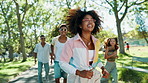 Running, gen z and friends with smile, outdoor and people with energy in nature, fun and happiness. Park, group and bonding on break for reunion, vacation and active on weekend, travel or together