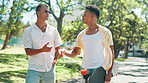 Skateboard, people and friends in park walking for bonding, discussion and outdoor nature. Fashion, cool skaters and men on path for talking on holiday, vacation or adventure on fun weekend for hobby