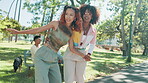 Skateboard, teaching and friends with woman in park for college vacation, spring break and urban fashion. Balance, help and energy with people in nature for skating, gen z youth and streetwear style