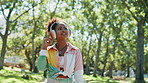 Nature, smartphone and woman with headphones for walk outdoor in park listening to music online. Happy, phone and female person streaming playlist, album or radio on app with audio tech in garden.