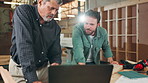 Teamwork, carpentry project or people on laptop in warehouse for manufacturing or furniture production. Mentor teaching, carpenter apprentice or online for timber, lumber or construction business