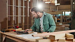 Carpentry, workshop and man on laptop writing for client woodwork orders, furniture and manufacturing. Factory, construction and person on computer for lumber, timber inventory and wood production
