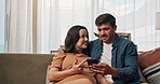Pregnancy, talking and couple on sofa with phone for online shopping, prenatal app or parenting website. Family, home and happy man with pregnant woman on smartphone for bonding, chatting and relax