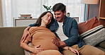 Relax, pregnancy and love with couple on sofa for support, bonding and family house discussion. Motherhood, care and rubbing stomach with man and woman in living room for commitment and baby