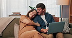 Laptop, pregnancy and research with couple on sofa for growth progress, baby milestones and love. Child care blog, happy and trimester update with man and woman in living room for family planning