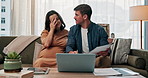Laptop, pregnancy and documents with couple on sofa for life insurance update, discussion and research. Maternity benefits, home and healthcare plan with man and woman in living room of family house