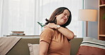 Pregnant woman, shoulder pain or injury with discomfort on sofa for bad posture, pressure or strain at home. Female person, pregnancy and sore ache with stress for muscle tension on couch at house