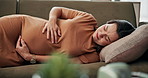 Stomach, pregnancy and relax with woman on sofa for love, support and maternity health. Calm, unborn baby and pregnant belly with mother in living room of family home for prenatal care and growth