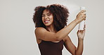 Face, black woman and spray on hair for natural wellness, growth and shine on white background. Afro beauty, luxury salon and happy girl smile with hairspray, cosmetic products and keratin treatment