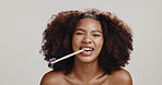 Happy, toothbrush and face of black woman in studio for dental hygiene, brushing teeth and oral care. Health, mouth and portrait of person for wellness, cleaning and fresh breath on white background