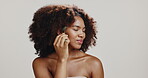 Beauty, smile and woman with jade roller in studio for radiant skin, lymphatic drainage and self care routine. Girl, cosmetics tool and massage face for dermatology and grooming on white background