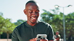Black man, phone and fitness at park, texting and smile for speed, challenge and monitor progress in summer. African person, smartphone and check mobile app for stats, steps and workout in Kenya