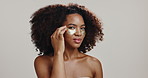 Beauty, woman and face with eye patches on studio background for puffiness reduction, skin hydration and hyaluronic acid. Dermatology, african girl and confident with undereye product for skincare