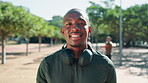 Smile, runner or face of black man in park for fitness training, workout or sports exercise. Portrait, happy or face of African athlete in headphones for running podcast, jog practice or audio Kenya