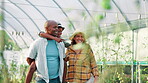 Farming, agriculture and parents with child for piggyback, bonding and conversation for plants growth. Father, mother and face of boy in greenhouse, pointing and sustainability for vegetables