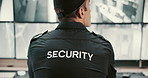 Back, security guard and man in control room, video surveillance and computer with safety service. Person, employee and officer in workplace, uniform or expert with inspection, camera and information