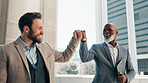 Outdoor, walking or happy business people fist bump for motivation, collaboration or corporate goals. Men, target achievement or financial advisors by balcony for project agreement, deal in company