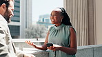 Businessman, woman and phone on balcony, talking and happy for pitch, insight or advice on break. People, smartphone and listening with mobile app, video or show progress with discussion for project