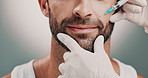 Hands, beautician and man with facial injection in studio for skincare, antiaging and collagen. Cosmetic, needle and plastic surgeon with person for face transformation with filler by gray background