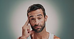 Man, face and massage temple in studio, migraine tension and stress with skincare on gray background. Portrait, frustrated and mature person with dermatology, headache and pressure for pain relief