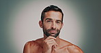 Skincare, face and man in studio with beard checking for ingrown hair, blackheads or acne. Cosmetic, hygiene and portrait of person with facial, dermatology or grooming routine by gray background.