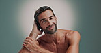 Pride, happy and man for face of skincare with facial glow, natural cosmetics and dermatology results. Portrait, male person or smile of grooming routine, self care and treatment on studio background
