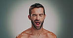 Skincare, wink and man in studio with beard checking for ingrown hair, blackheads or acne. Cosmetic, hygiene and portrait of person with facial, dermatology or grooming routine by gray background.