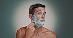 Face, man and shaving brush with skincare foam, hair removal and facial hygiene for self care. Portrait, person and tools with grooming routine, dermatology cream and maintenance in studio background