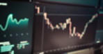 Computer screen, graphs and stock market in office for trading, review or study trend with global exchange. Blur, monitor and charts for analysis, fintech and statistics for profit, loss or price