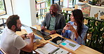 Cafe, meeting and business people with conversation, b2b networking or collaboration review. Graph discussion, teamwork and coffee shop communication with technology for remote work project ideas