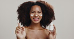Beauty, cream and face with woman in studio for skincare, hydration and self care. Cosmetics, glow and dermatology with African person on white background for shine, spa treatment and facial lotion