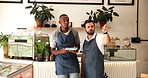 People, waiter and point on tablet at cafe for planning, online order and booking of menu update. Men, talking and digital app of inventory management, review customer service and sales performance

