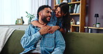 Hug, couple and love in living room with smile, bonding and gossip on sofa in apartment. Embrace, man and woman with communication in lounge, relationship and relax in home lounge with support