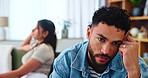 Couple, man and frustrated in home after fight, disagreement and toxic relationship in lounge. Sofa, woman and male partner with anger for argument, cheating affair and silent treatment for divorce