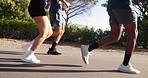 Fitness, mountain road and legs of people running for workout, exercise and marathon training together. Sports, runners and men and women for wellness, health and performance for challenge outdoors