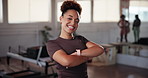 Happy, face or woman with arms crossed in pilates class for exercise, posture training or body. Portrait, instructor or proud girl in yoga session for fitness support, health or wellness in studio