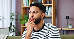 Biting nails, stress and thinking with man on sofa in living room of home for concern or worry. Anxiety, breathing or nervous and thoughtful person in apartment with coping mechanism for crisis