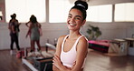 Confident, face or woman with arms crossed in yoga class for exercise, posture training or body. Portrait, instructor or proud girl in pilates session for fitness, health or wellness in gym studio 