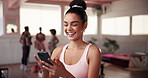 Phone, laughing and woman at pilates class typing for communication online with mobile app. Fitness, studio and female person with cellphone for social networking or contact on media with exercise.