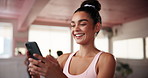 Cellphone, laughing and woman at pilates class typing for communication online with mobile app. Health, studio and female person with phone for social networking or contact on media with exercise.