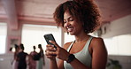 Smartphone, laughing and woman at pilates class typing for communication online with mobile app. Health, studio and female person with phone for social networking or contact on media with exercise.