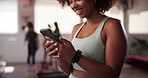 Cellphone, happy and woman at pilates class typing for communication online with mobile app. Health, studio and female person with phone for social networking or contact on media with exercise.